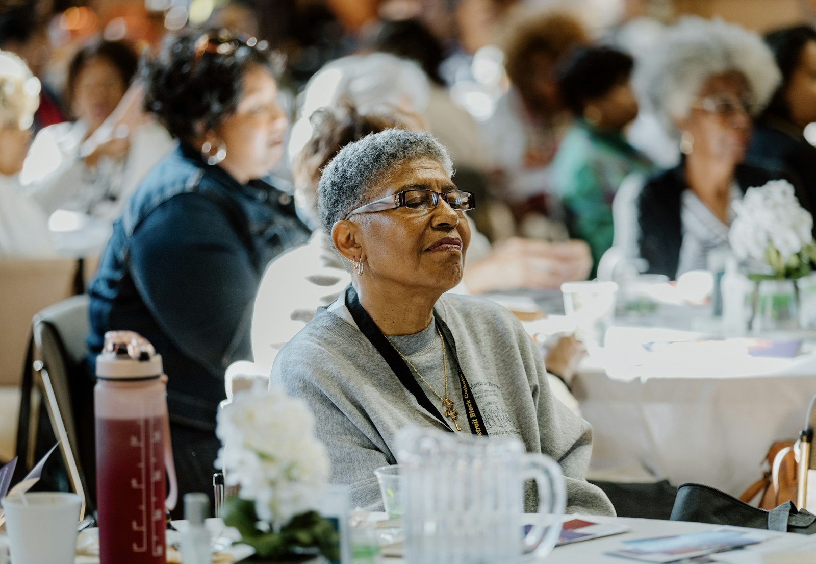 A woman listens to Dr. Valerie D. Lewis-Mosley's keynote address. God knows each and every person's heart, Lewis-Mosley said, and answers prayers in His own wise time.