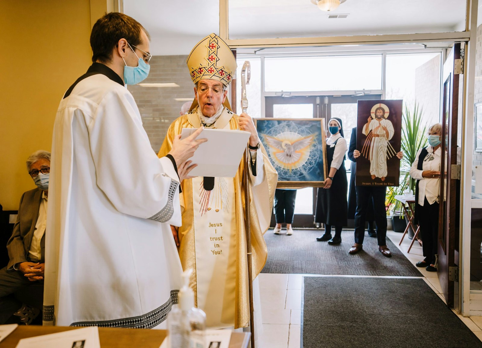 Archbishop Allen H. Vigneron reads a decree officially dedicating the Divine Mercy Center in Clinton Township as an archdiocesan shrine, the Shrine of Jesus the Divine Mercy, on Divine Mercy Sunday, April 11, 2021. (Valaurian Waller | Detroit Catholic)