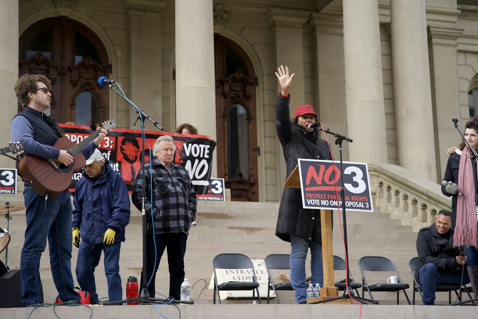 Sylvia Williams, a National Day of Prayer area leader, speaks to the crowd about the dangers of Proposal 3 from the steps of the state capitol Oct. 15.