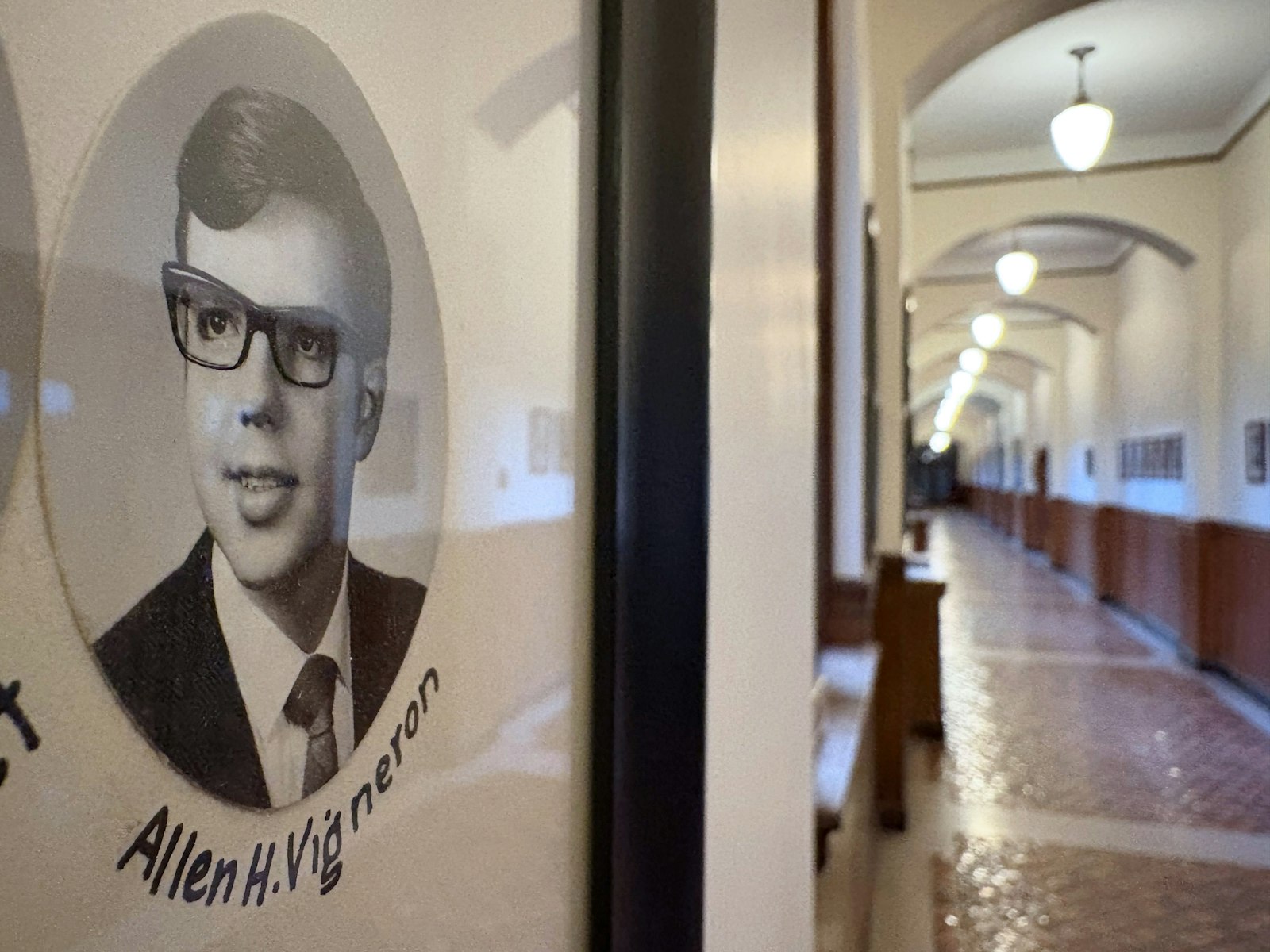 Archbishop Vigneron's portrait is seen in the hallways of Sacred Heart Major Seminary as part of the class of 1970. The future archbishop graduated from Sacred Heart's high school and went on to enter as a seminarian, crediting the influence of priests and mentors at the time with sparking his love and devotion to the priesthood. (Photo by Michael Stechschulte | Detroit Catholic)