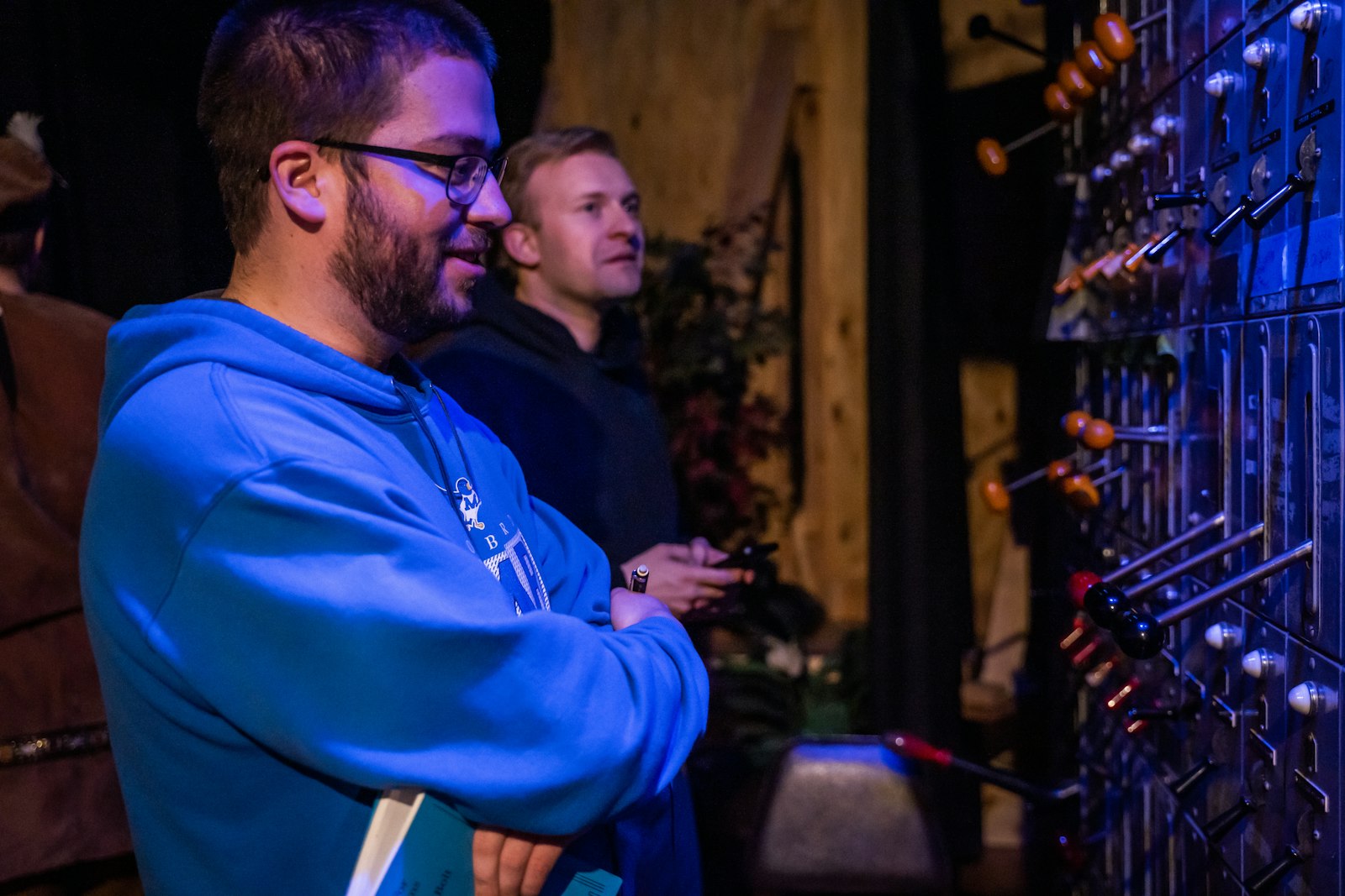 Seminarians Daniel Hackenjos (lighting director) and Stephen Moening (assistant lighting director) monitor the performance backstage. Seminarians handled the backstage duties, including set design, costumes, hospitality and promotions.