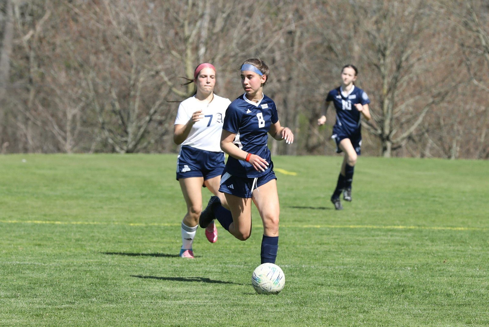 Freshman Elle Martin checks the defense while advancing the ball upfield during Bloomfield Hills’ Academy of the Sacred Heart’s 5-0 victory over Austin Catholic on April 16.