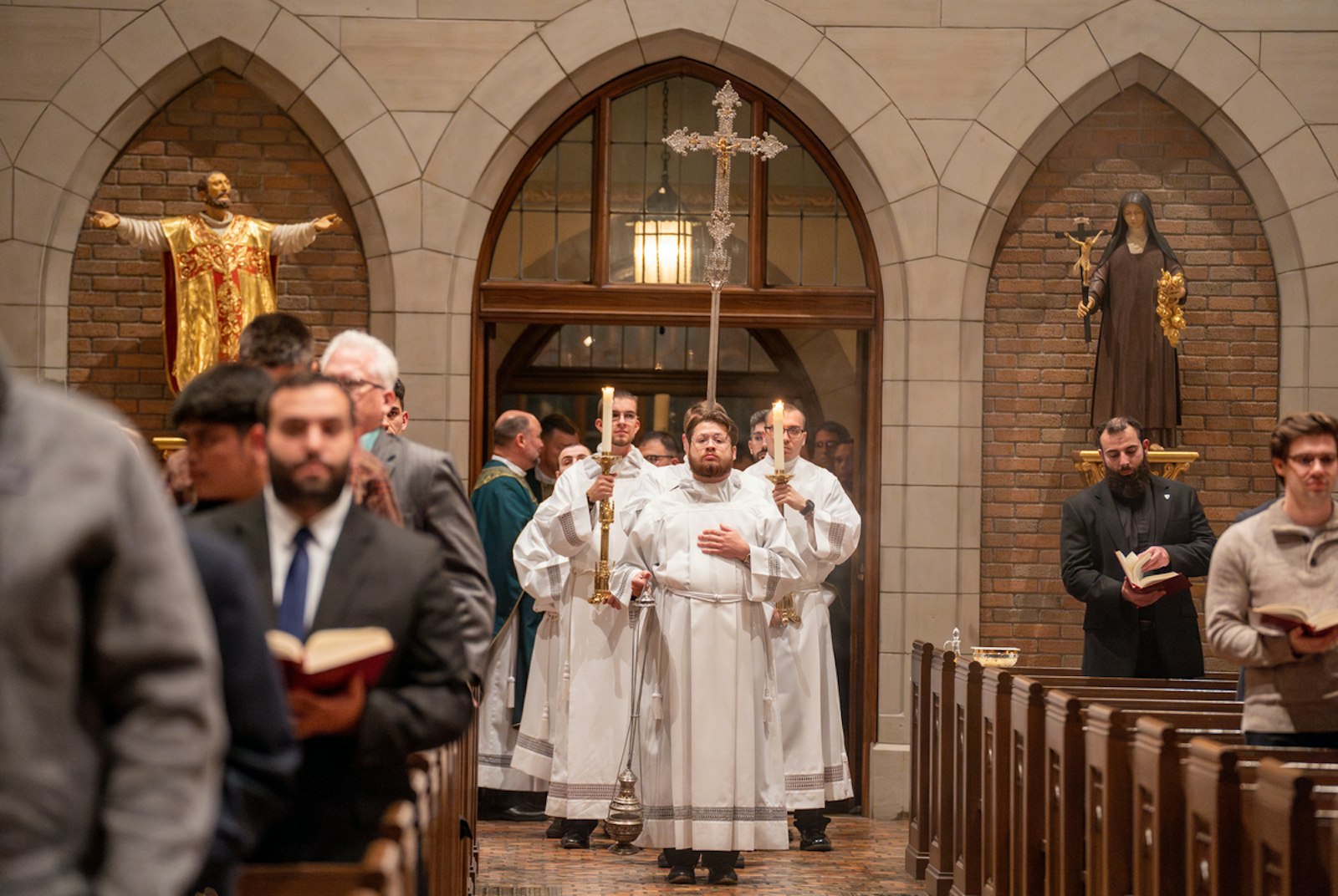 The ministries of lector and acolyte are both significant in that they are reminders of the two ways in which Christ meets his people — through the sacred Scriptures and through the holy Eucharist, Bishop Walsh said.