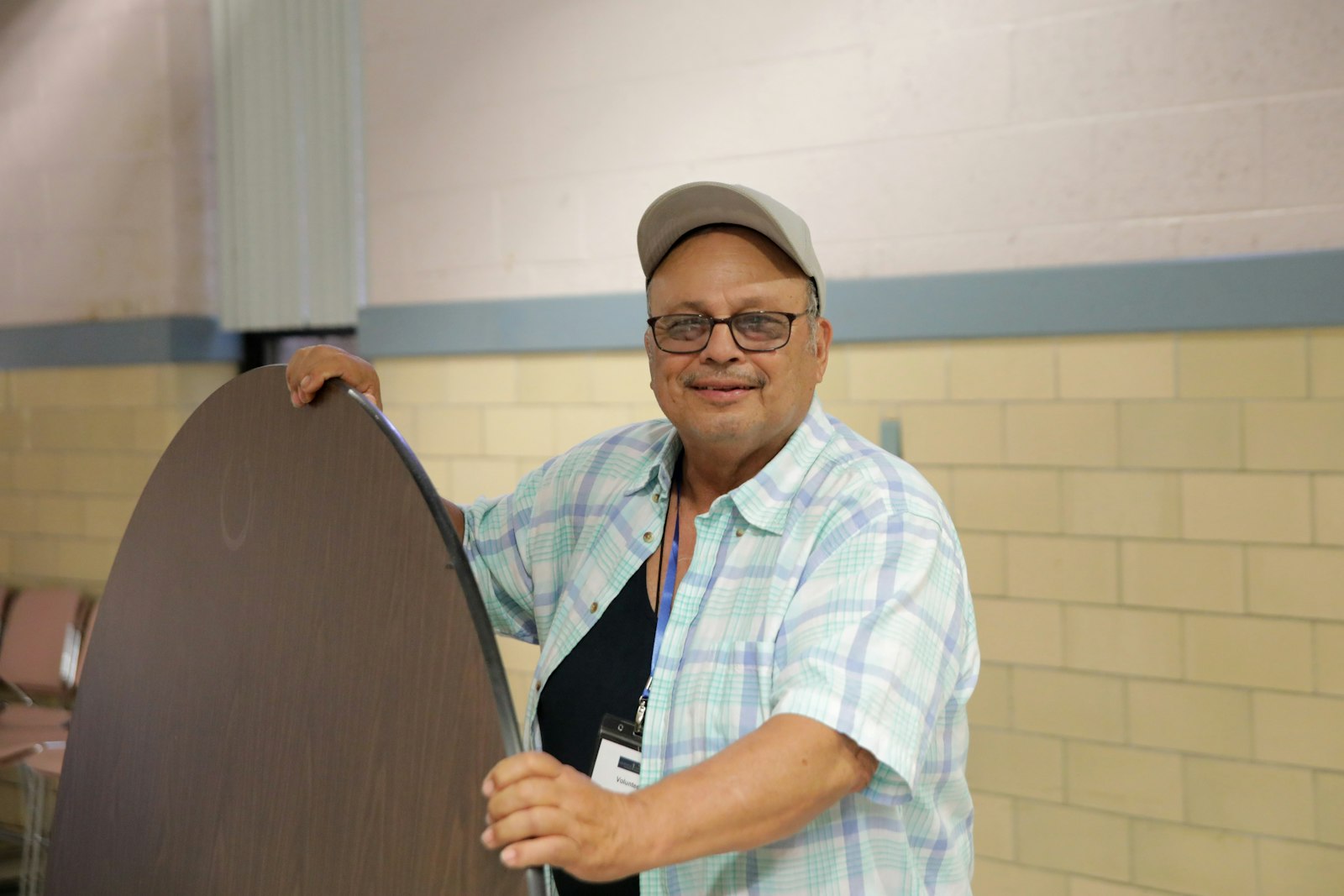 Ish Ledesma "Coach Ish" has been volunteering at the All Saint Soup Kitchen and Food Pantry for more than 10 years. Many former volunteers, All Saints alumni and former parishioners are volunteering at the new location in former St. Andrew gymnasium.