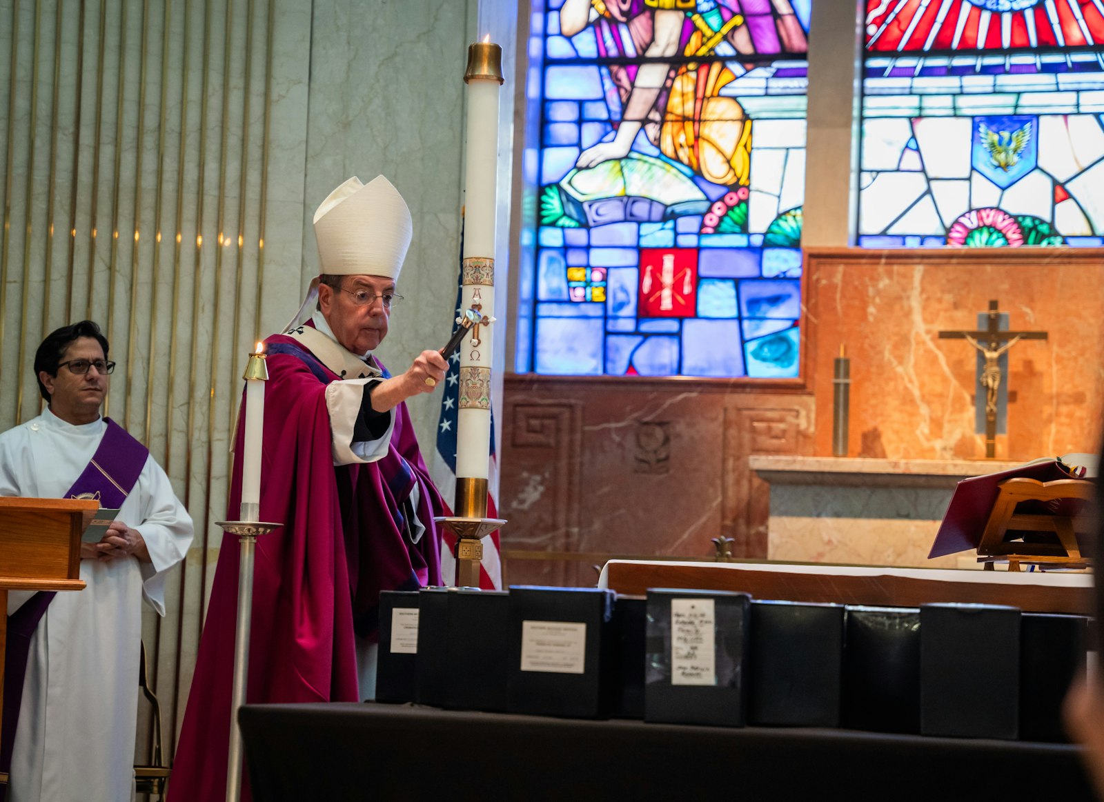 Archbishop Vigneron blesses cremated remains brought to the cemetery as part of the Church's "Gather Them Home" initiative, which invites families to bring their loved ones to be buried at no cost.