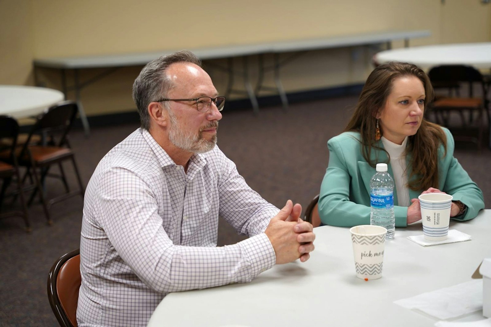 Kurt and Tia Klein of St. Isidore Parish in Macomb Township listen during a conversation about finding truth in art at the auxiliary hall of the National Shrine of the Little Flower Basilica in Royal Oak earlier this month. The group strives to meet quarterly, usually in a group member's home or in a public place.