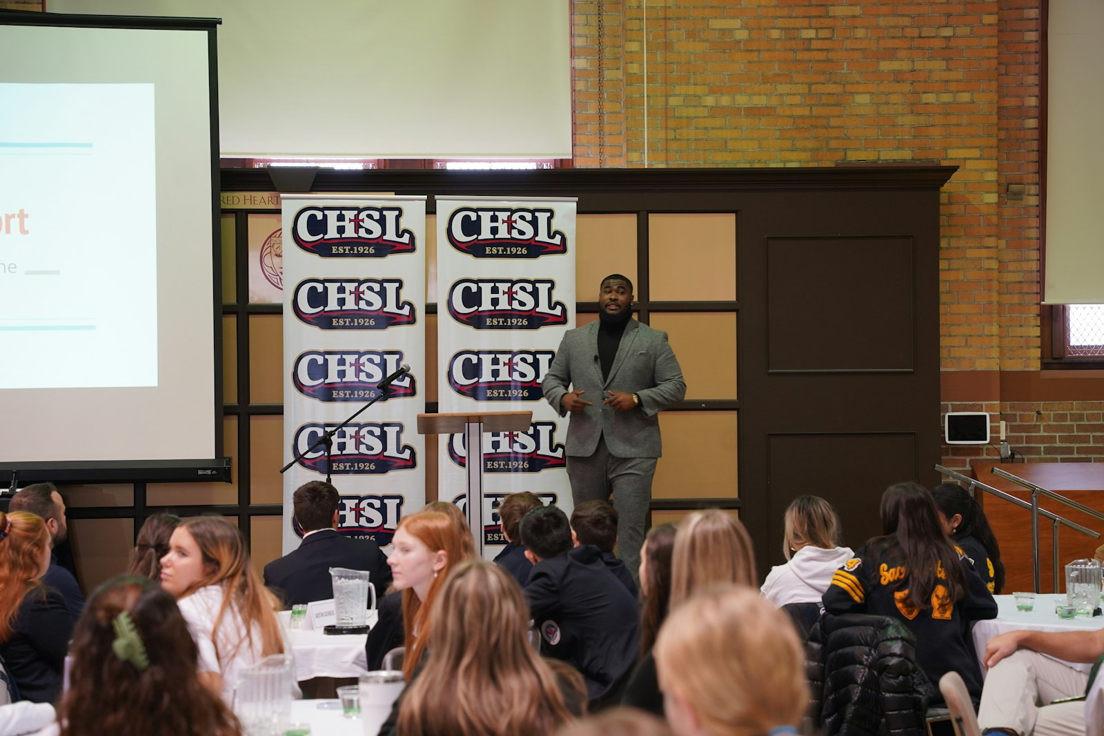 Chris Okoye, a Detroit Catholic Central High School alumnus who has played for the NFL's Cincinnati Bengals and in the USFL, speaks to Catholic High School League student-athletes about what it takes to execute the plan God has given each person and how his faith helped him overcome challenges in his career.