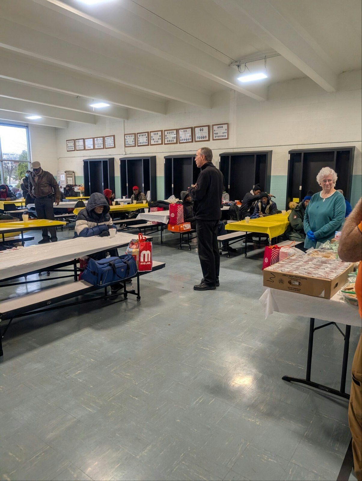 What started as a small meal for 10-12 men in the parish's rectory today feeds approximately 130 to 140 people, who gather in the school's gym. (Photos courtesy of Tim Murphy)