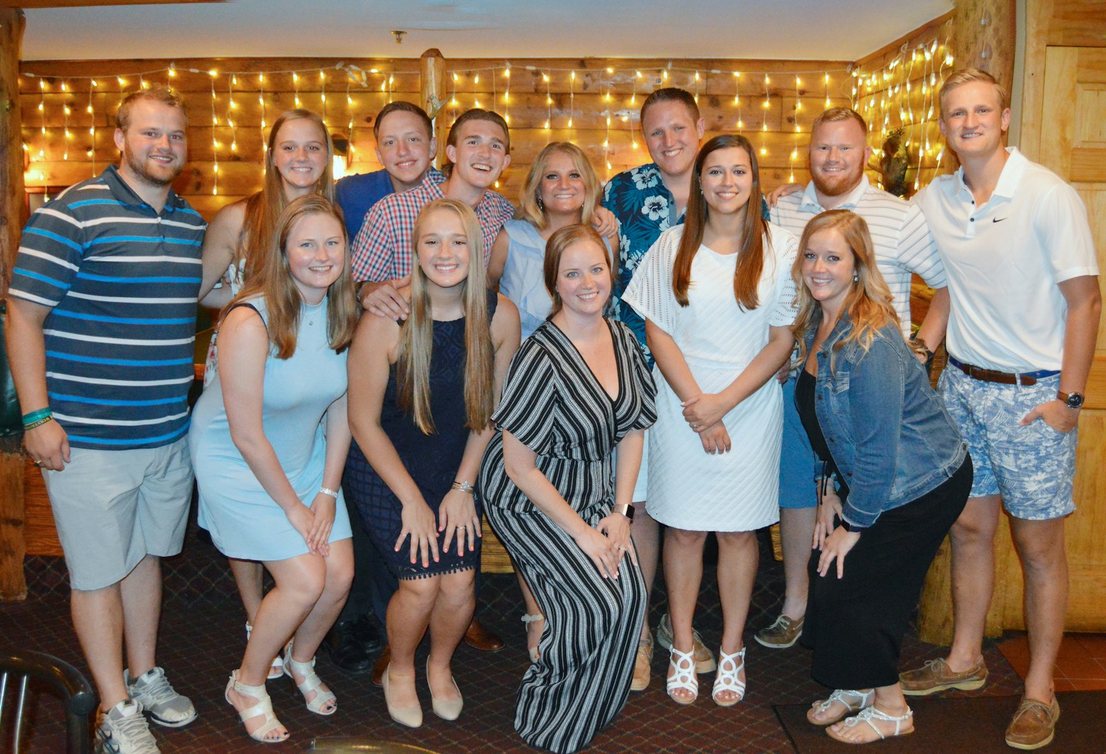 Thirteen members of the Wardowski family, all of whom are Bishop Foley Catholic graduates, gather together for one of their many family celebrations.