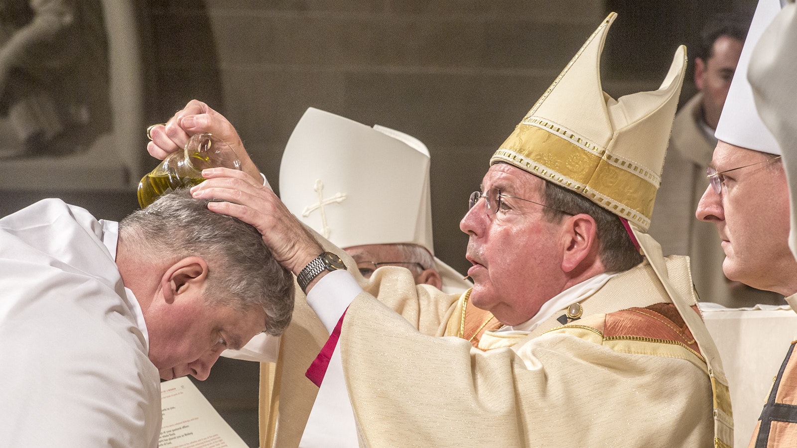 Archbishop Vigneron anoints the head of Auxiliary Bishop Gerard W. Battersby with chrism oil during the episcopal ordination of Bishop Battersby and Bishop Robert J. Fisher on Jan. 25, 2017. The announcement of Bishop Battersby and Bishop Fisher's appointment came three days after the close of Synod 16. (Larry A. Peplin | Detroit Catholic file photo)