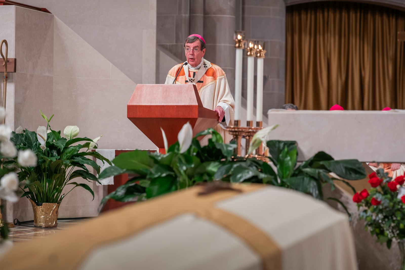 Detroit Archbishop Allen H. Vigneron reads a letter of condolence sent from Pope Francis via his apostolic nuncio to the United States, Cardinal Christophe Pierre.