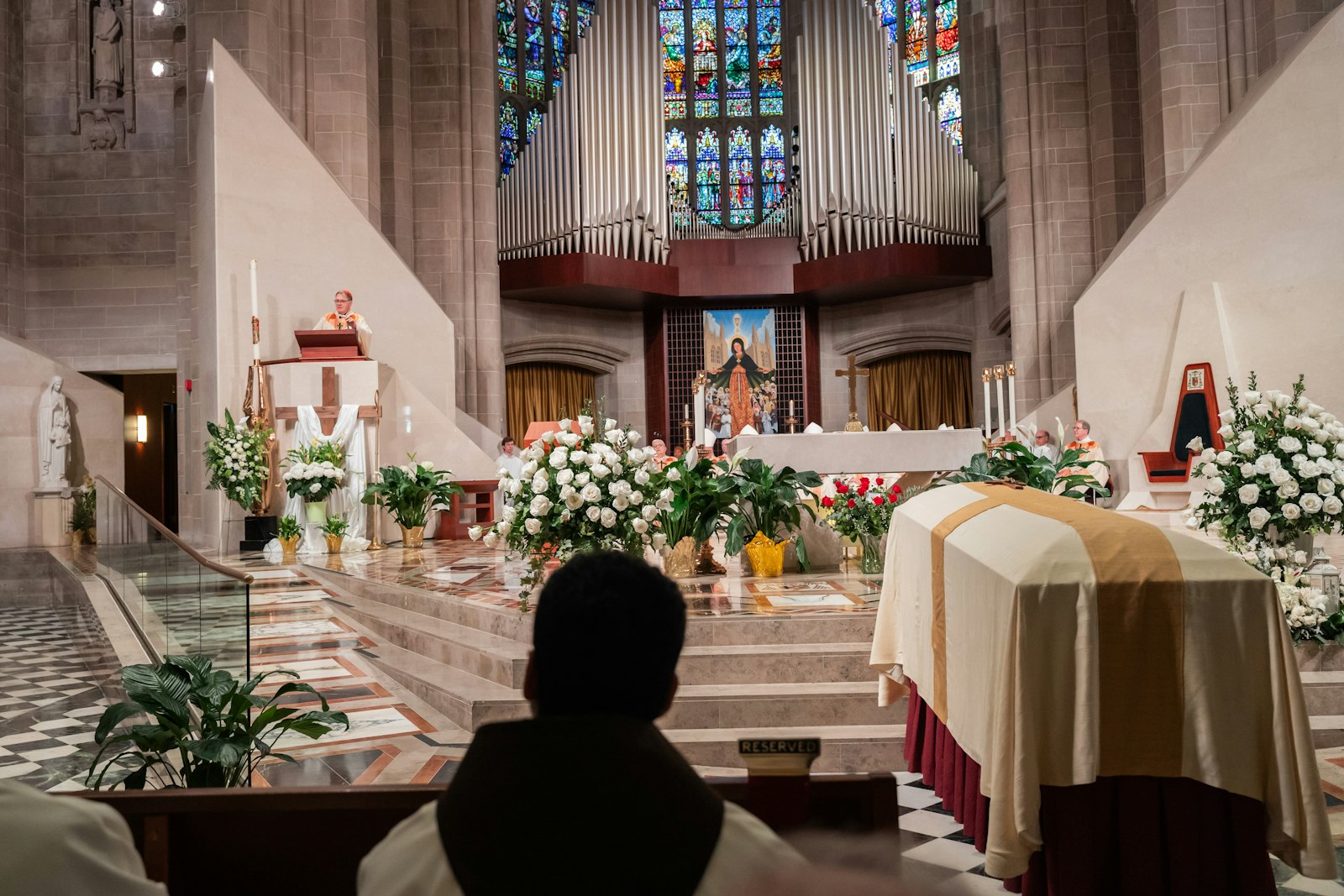 Cardinal Tobin preaches to a cathedral full of mourners April 13 during the funeral Mass for retired Detroit Auxiliary Bishop Thomas J. Gumbleton. Earlier in the week, visitations were held for Bishop Gumbleton at the IHM Sisters' motherhouse in Monroe, Sacred Heart Church in Detroit, and Chas. Verheyden Funeral Home in Grosse Pointe Park.
