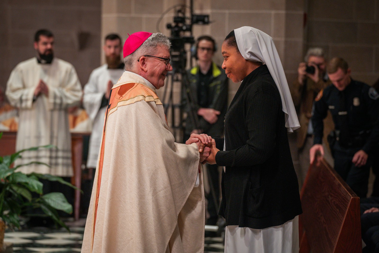 Bishop Monforton greets representatives of the Archdiocese of Detroit for the first time as a new auxiliary bishop.