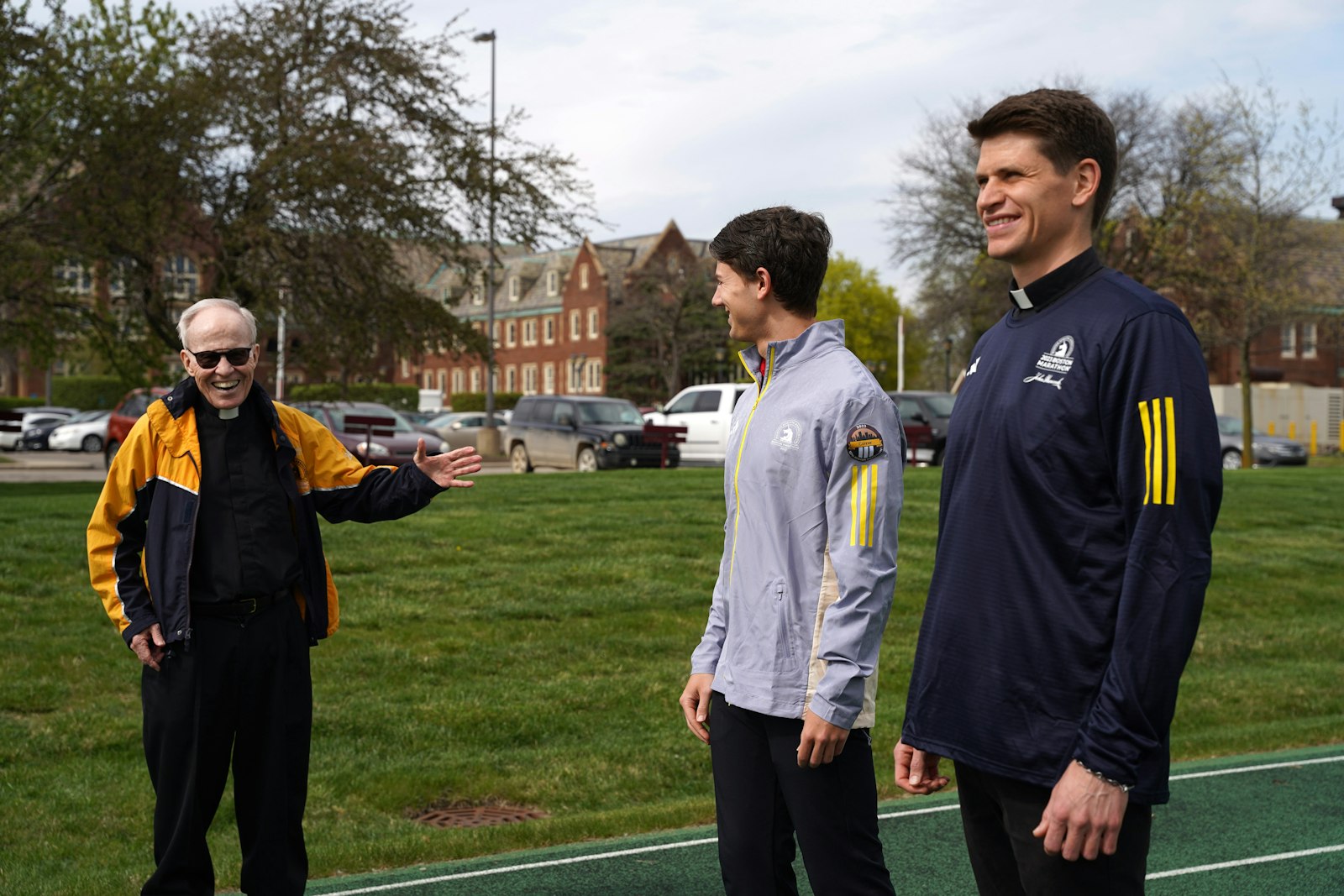 Matthew Conner and Deacon Seamus Kettner trained for the marathon with some advice and help from Fr. Richard Cassidy, left, a professor of Sacred Scripture at Sacred Heart and a Boston Marathon veteran. (Daniel Meloy | Detroit Catholic)