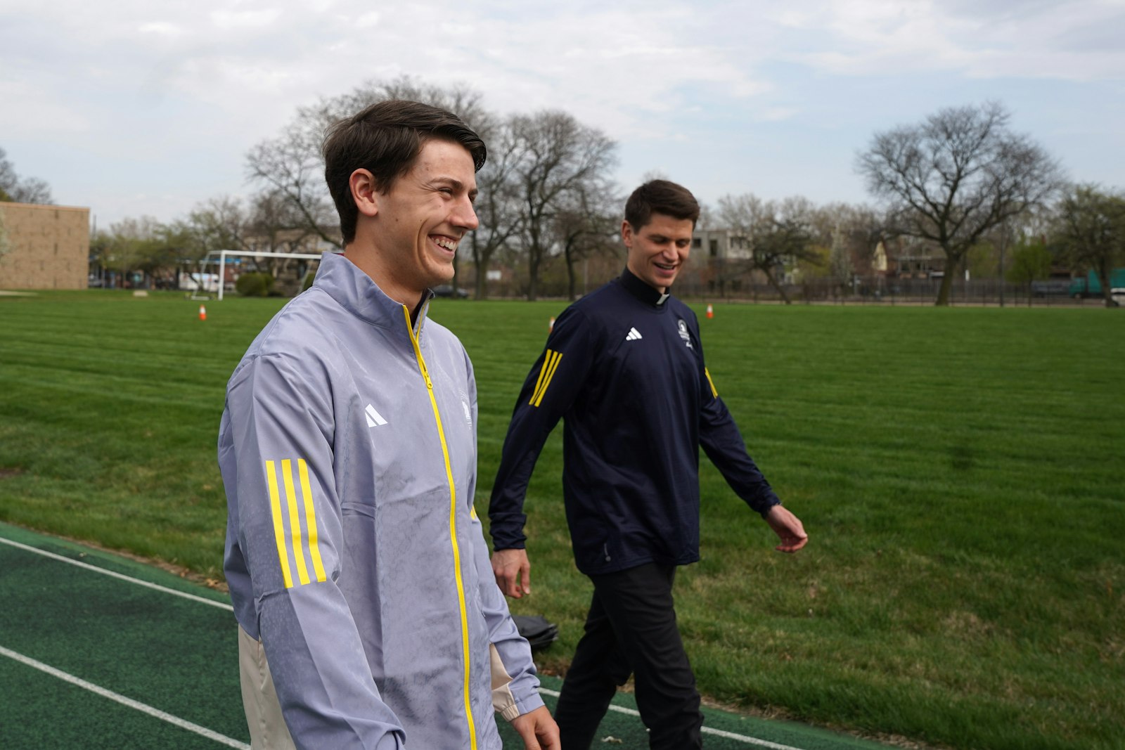 Matthew Conner and Deacon Seamus Kettner walk the track at Sacred Heart Major Seminary. Conner finished the Boston Marathon in 2 hours, 55 minutes, and 10 seconds, while Deacon Kettner finished the marathon in 2 hours, 42 minutes, and 1 second. (Daniel Meloy | Detroit Catholic)