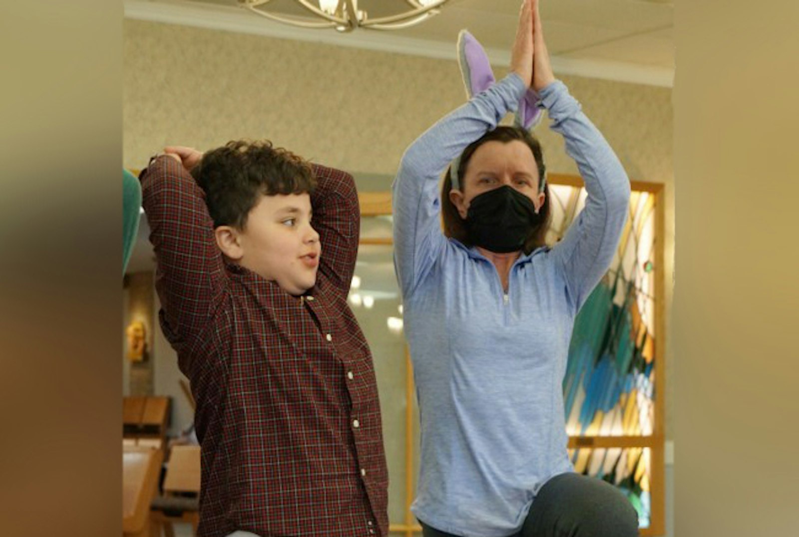 Physical therapist Amy Mittelstaedt teaches students stretches and exercises as student Emanual Hermiz tries them out April 9. Mittelstaedt and Dr. Eva Molenda regularly give talks and lessons to the group about healthy living, good posture and eating habits.