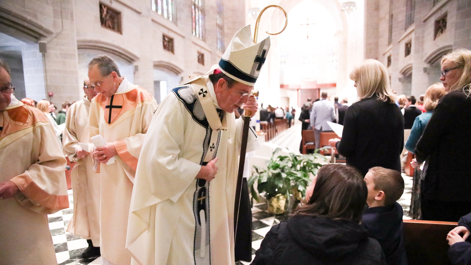 Archbishop Vigneron stops to talk to a young student during the annual Catholic Schools Week Mass at the Cathedral of the Most Blessed Sacrament on Jan. 31, 2018. (Naomi Vrazo | Detroit Catholic file photo)