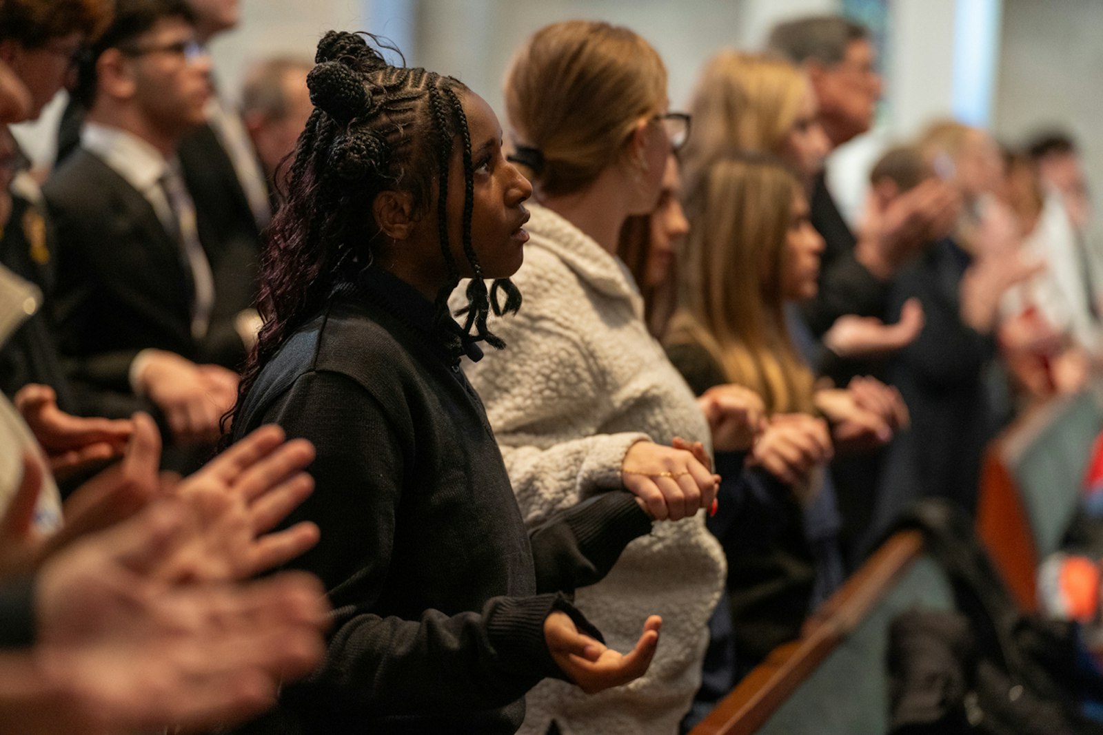 Students pray during the annual Catholic Schools Week celebration and Mass.