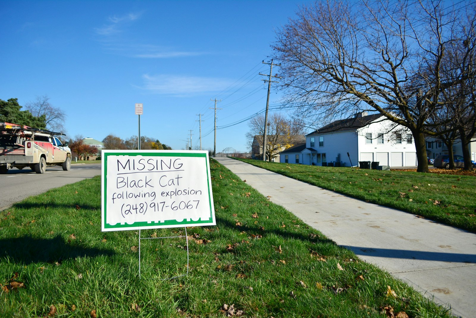 A sign asks for help locating a missing cat after the Nov. 19 explosion at Keatington New Town Association condominiums. While no one was killed, dozens of residents are displaced from their homes, with some missing pets.