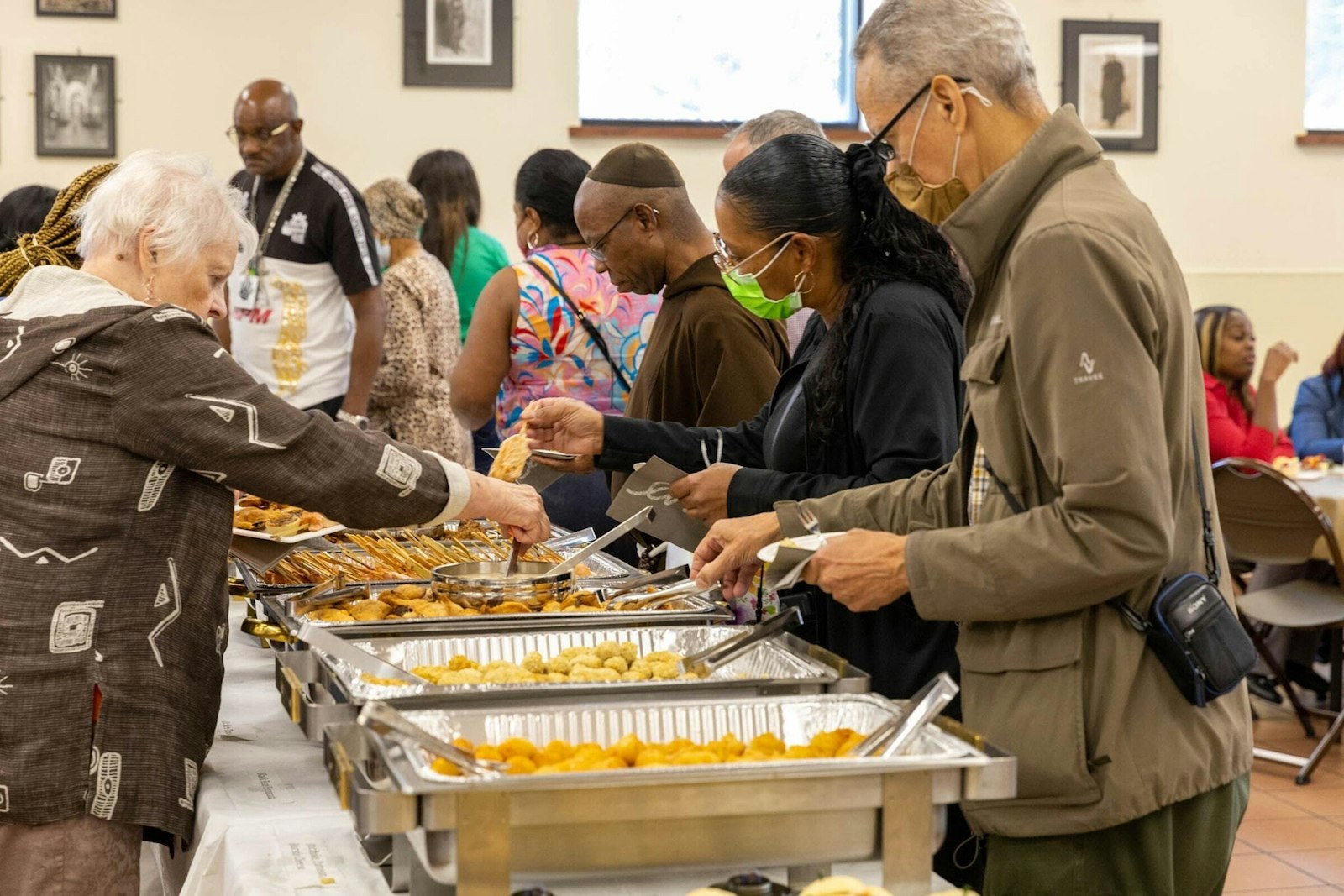 Guests are served at the Capuchin Soup Kitchen on Meldrum Street on Sept. 16, 2022. The soup kitchen, open Monday through Friday, 8:30 to 9:30 a.m. for breakfast, 11 a.m. to 1 p.m. for lunch and 4-5 p.m. for dinner, and Saturday breakfast, aims to be a place for guests to lounge and relax in between meals or stay warm and dry during inclement weather. (Steven Stechschulte | Capuchin Franciscan Province of St. Joseph)