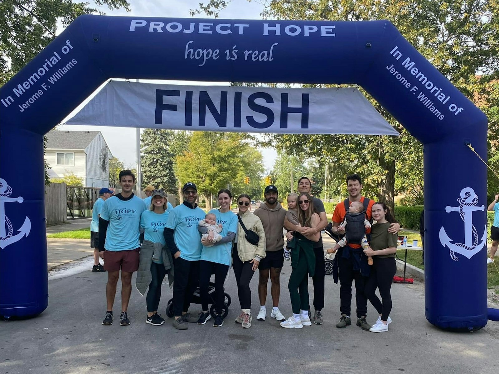 The Carusos pose for a photo with members of St. Clare of Montefalco Parish in Grosse Pointe Park during the parish's annual "Project Hope" fundraiser, a "5K and Pray" event that took place Sept. 16. (Courtesy of St. Clare of Montefalco Parish)