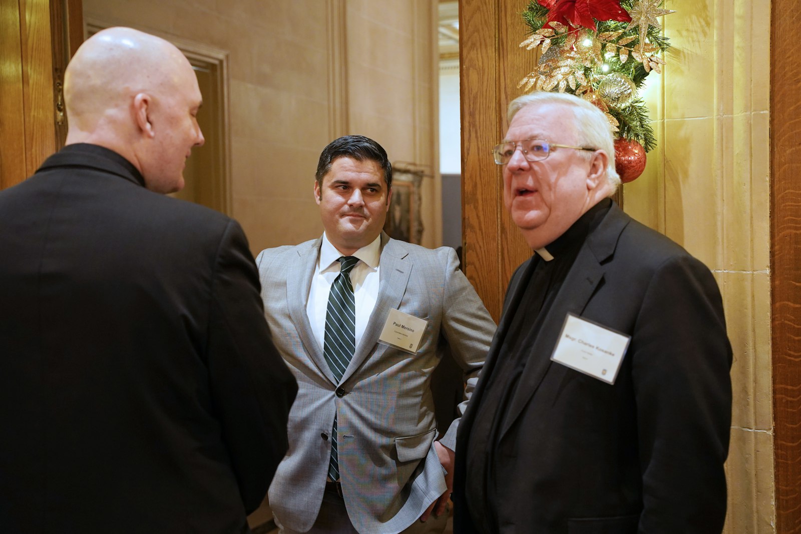 Paul Mersino, a committee member for the Catholic Foundation of Michigan's St. Margaret of Castello Grant, speaks with Fr. Jim Lowe, CC, and Msgr. Chuck Kosanke. The newly established St. Margaret of Castello Grant was awarded to Divine Child High School in Dearborn for expanding its inclusion program for students with special needs.