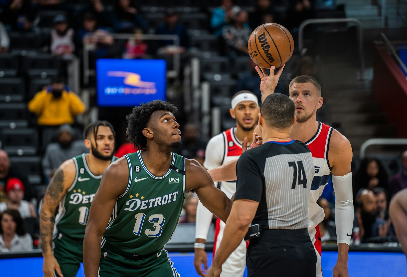 The Detroit Pistons’ James Wiseman prepares to tip off against the Washington Wizards’ Kristaps Porzingis during a March 7 game at Little Caesars Arena in Detroit. The Wizards defeated the Pistons, 119-117, on a night when the Pistons were wearing their green City Edition “313” jerseys in honor of Ceciliaville.