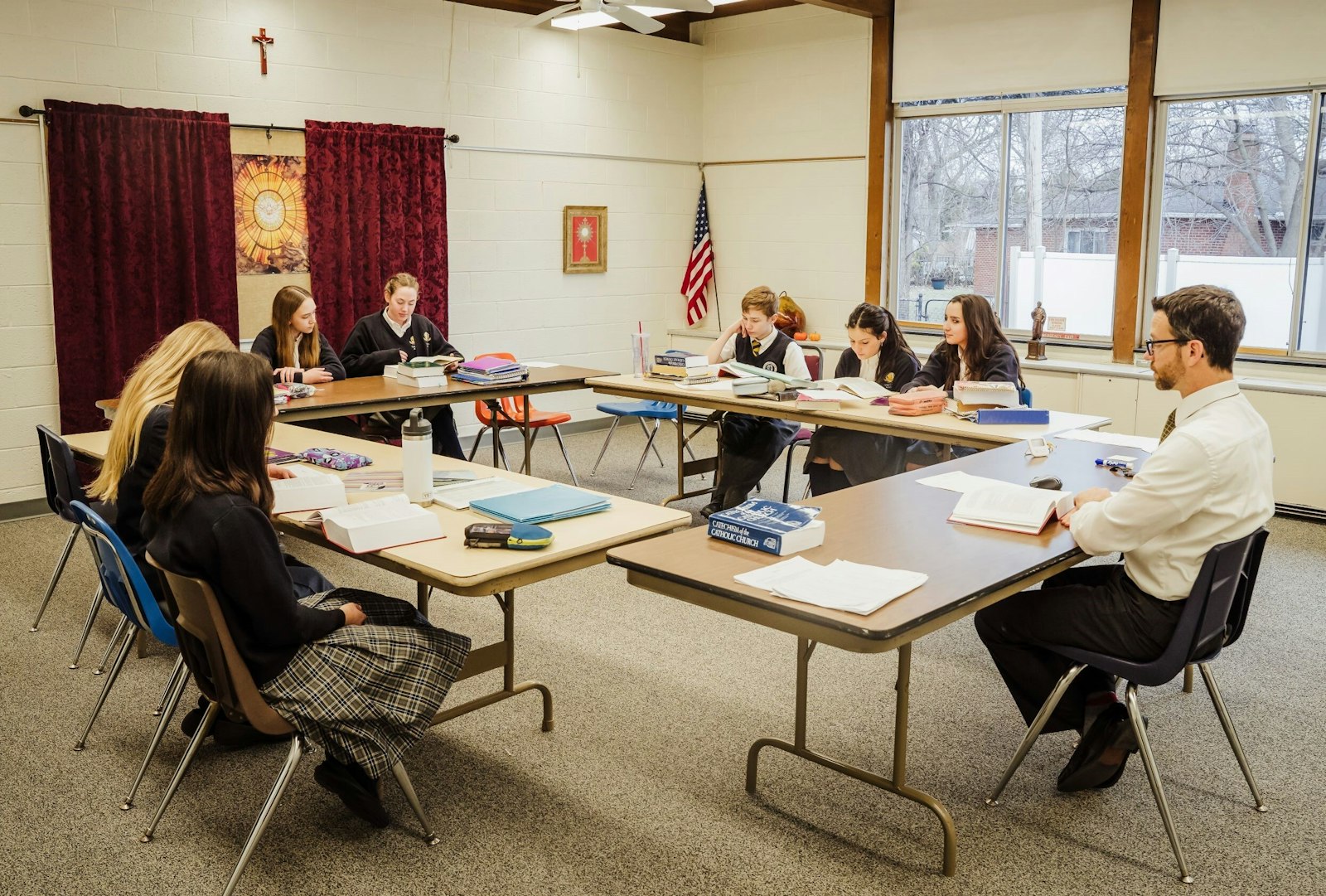 Teachers at Chesterton Academy of Our Lady of Guadalupe use the Socratic method of teaching, a form of cooperative argumentative dialogue between the teacher and student, emphasizing critical thinking skills and a holistic approach to learning.