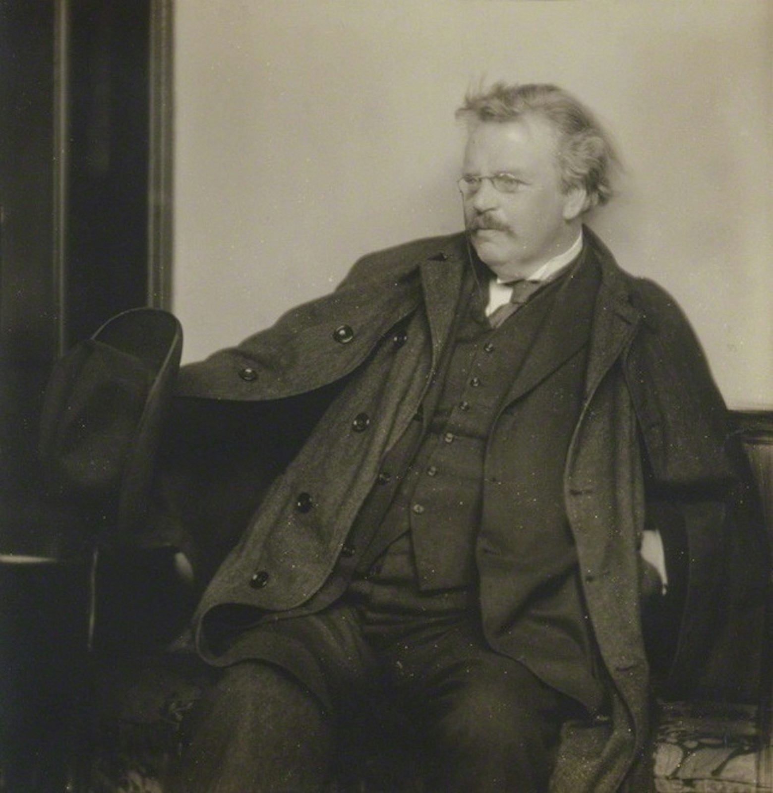 Chesterton enjoyed debating various topics with friends and colleagues at the pub. He was a particular collector of friends of various different backgrounds and perspectives, something the Southeast Michigan Chesterton Society strives to do in its monthly meetings. (Herbert Lambert, Public domain, via Wikimedia Commons)