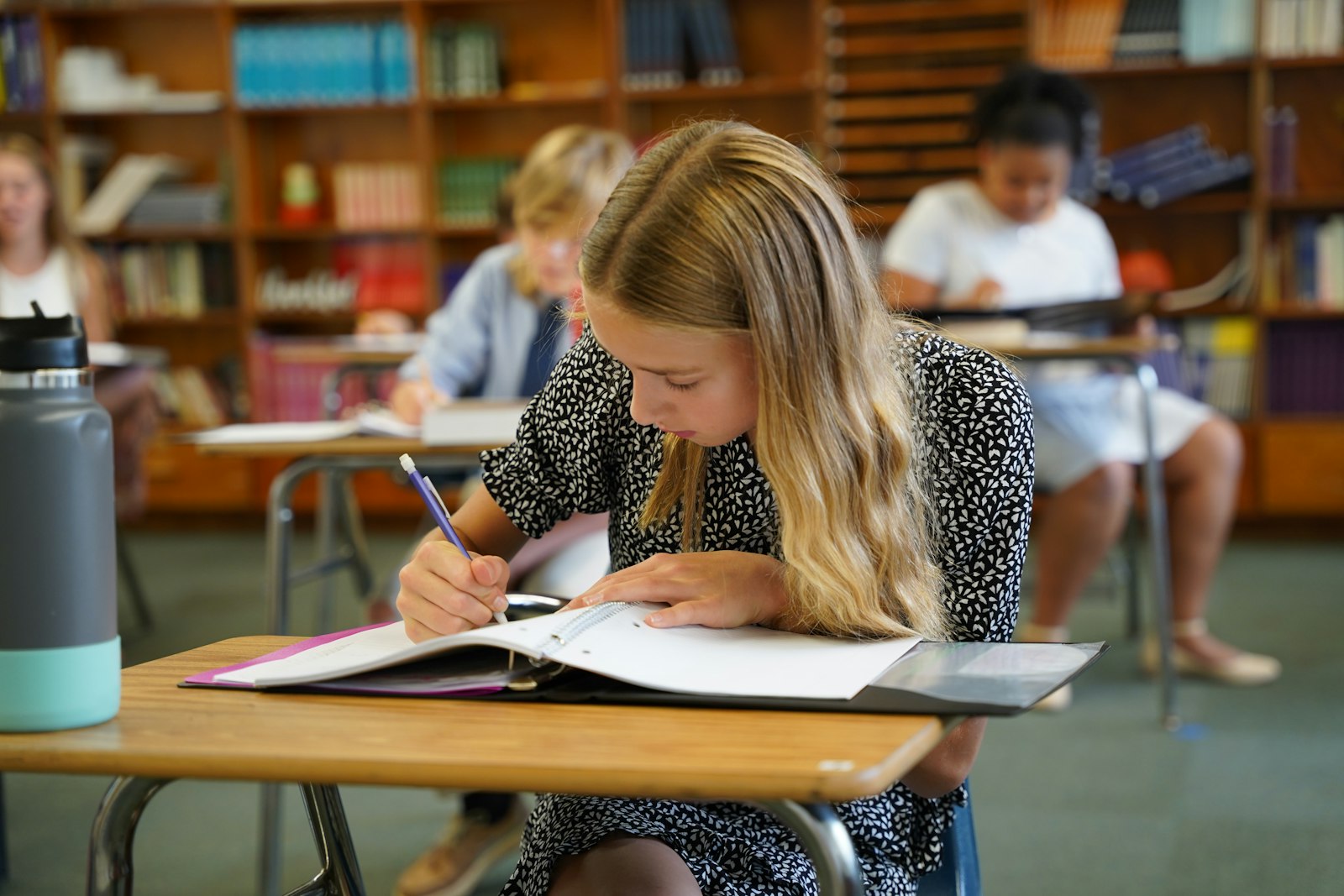 A young learner completes her assignment as part of St. Patrick School's new classical curriculum. The tight-knit rural community's support of St. Patrick School has allowed the school to thrive over the centuries, one of the longest-running Catholic schools in Michigan. (Daniel Meloy | Detroit Catholic)
