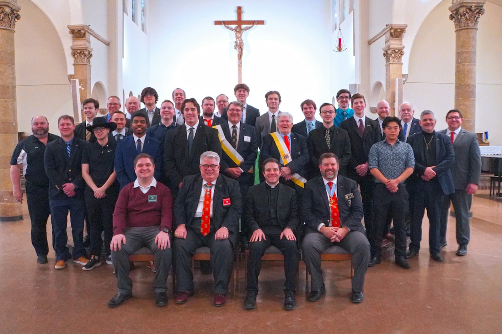 The founding members of the Blessed Carlo Acutis Council of the Knights of Columbus, based out of Detroit Catholic Campus Ministry, pose for a group photo following their exemplification with representatives from the Knights of Columbus and chaplain Fr. Matthew Hood. The council is the second college-based council in Michigan.