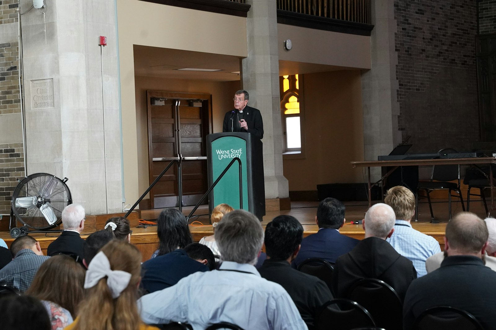 Archbishop Allen H. Vigneron delivers a keynote address during the 33rd annual Sacred Music Colloquium at Wayne State University's St. Andrew Hall on June 21.
