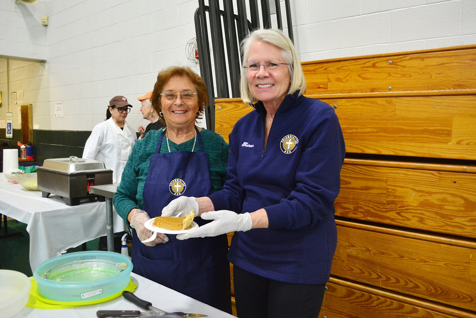 Judy Whitlock, left, and Karen Politowicz serve dessert during St. Patrick Parish's fish fry on Feb. 24. The parish's Columbiettes auxiliary serves alongside its Knights of Columbus council and provides support, activities and volunteer opportunities for women of the parish and beyond.