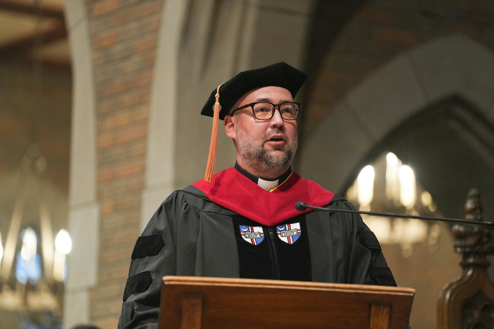Fr. Stephen Burr, rector and president of Sacred Heart Major Seminary, addresses the graduates of the Class of 2024 during the commencement exercises following the Baccalaureate Mass.