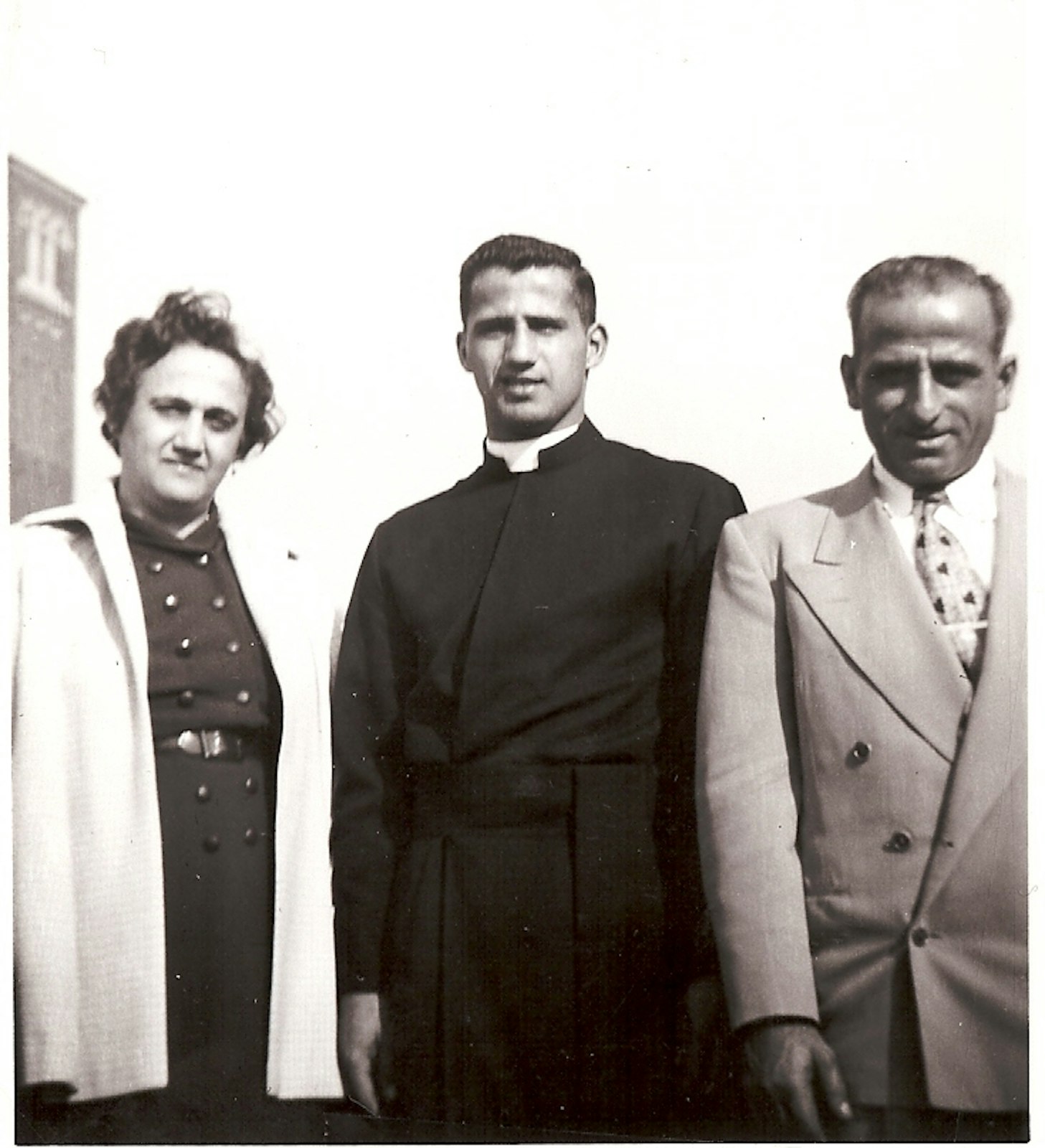 Fr. Norman Thomas, pictured with his parents, was born Dec. 18, 1930, in Highland Park and grew up at Madonna Parish in Detroit (now St. Moses the Black Parish).  Thomas graduated from Sacred Heart Seminary High School and College before heading to St. John’s Provincial Seminary in Plymouth. He was ordained a priest by Cardinal Edward A. Mooney of Detroit on June 4, 1955. (Photo courtesy of Sacred Heart Parish)