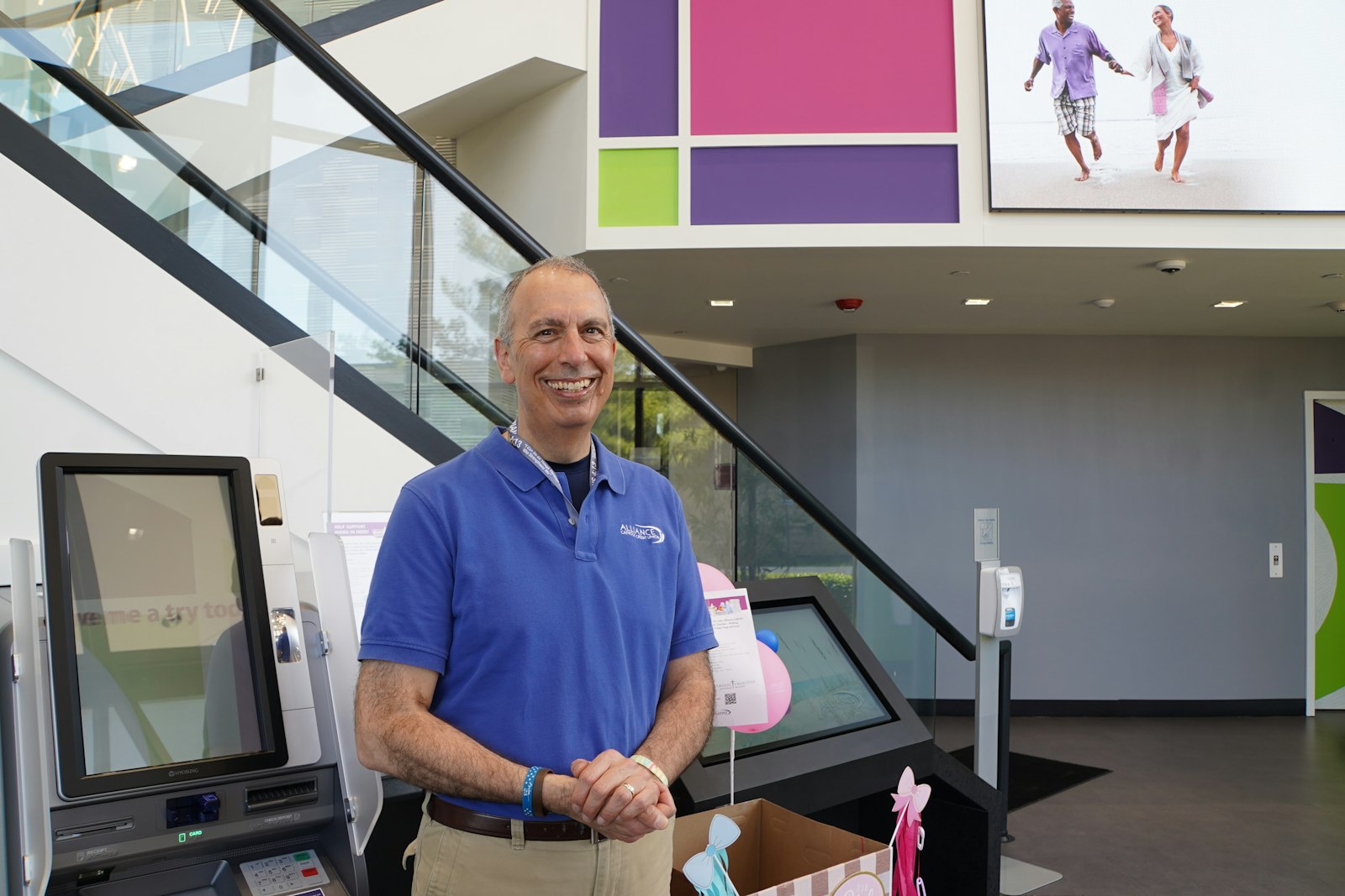 Keith Burke, vice president of marketing and community relations for Alliance Catholic Credit Union, stands in the lobby of ACCU's Farmington Hills headquarters. Alliance Catholic Credit Union is the largest Catholic credit union in Michigan, managing an estimated $500 million in assets.