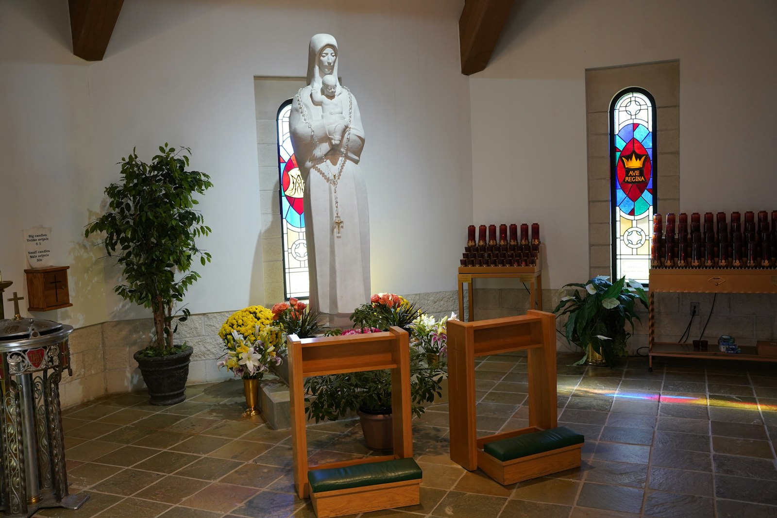 The statue of Madonna and Child that graced the outdoor grotto of St. Jerome Church on Eight Mile now resides inside St. Lucy Church in Troy. St. Lucy contains many elements of St. Jerome, including its bells, baptismal font and Stations of the Cross.