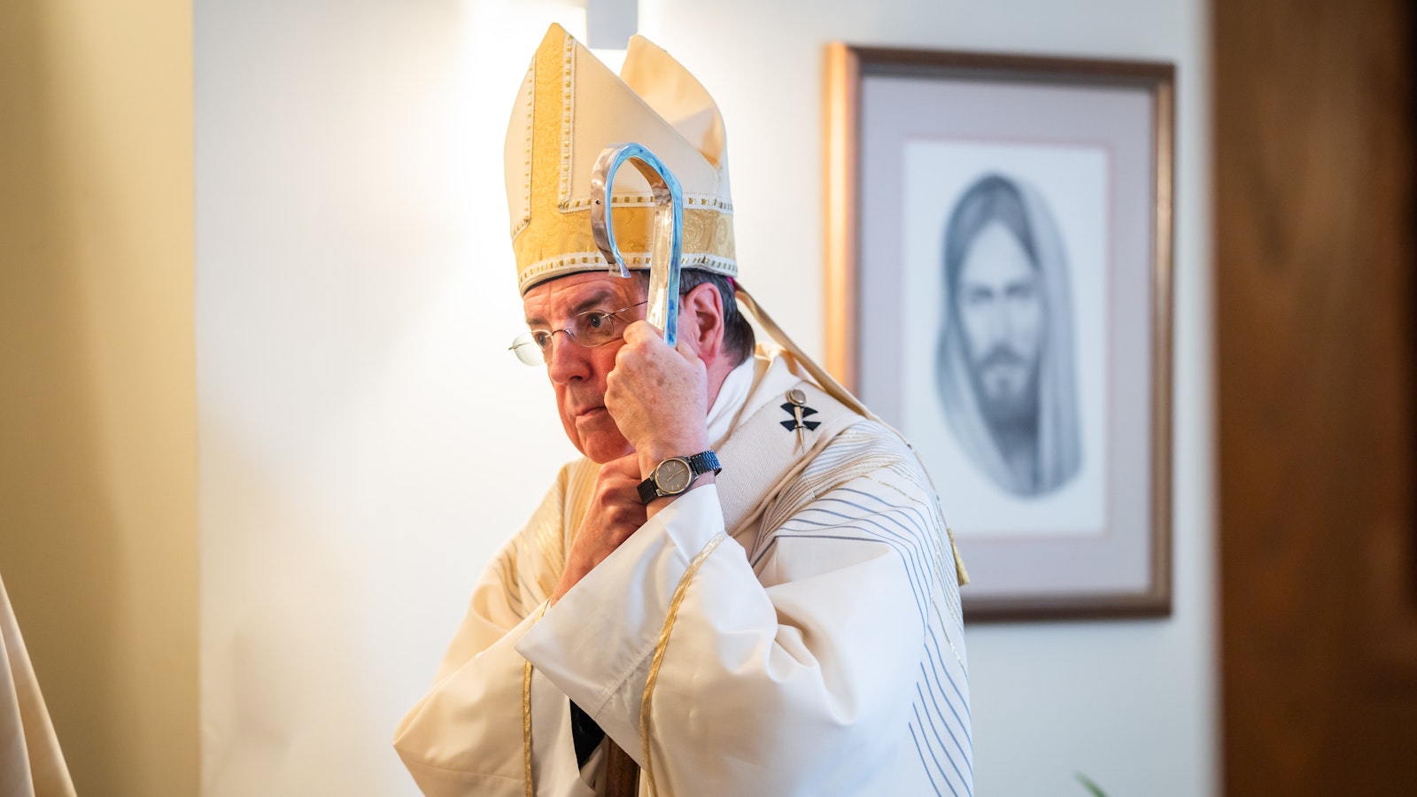 Archbishop Vigneron leans on his crozier before celebrating a candidacy Mass for seminarians Aug. 23, 2023, at Manresa Jesuit Retreat House in Bloomfield Hills. (Valaurian Waller | Detroit Catholic)