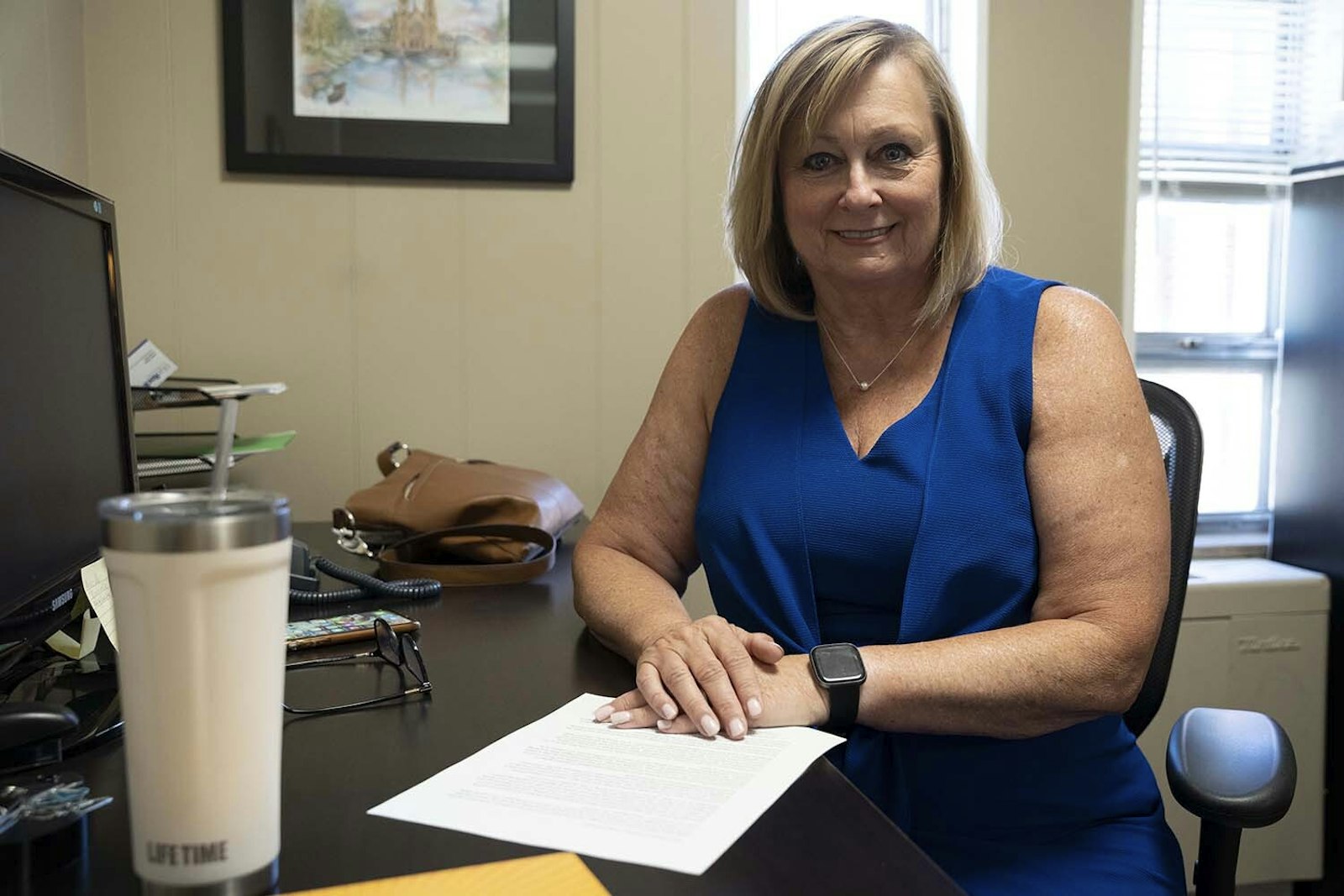 Linda Maccarone sits in her office at St. Mary Parish in Royal Oak, where she's been the director of the parish's mission. In her new role, Maccarone works with each parish in the family to identify strengths and serve other ministries by ensuring operations run smoothly.