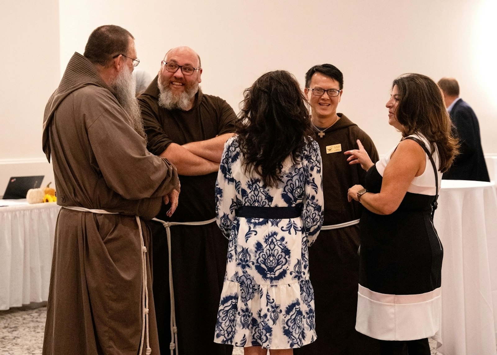 Capuchin friars mingle with guests at Laurel Manor in Livonia during Catholic Charities of Southeast Michigan's annual gala Sept. 12.