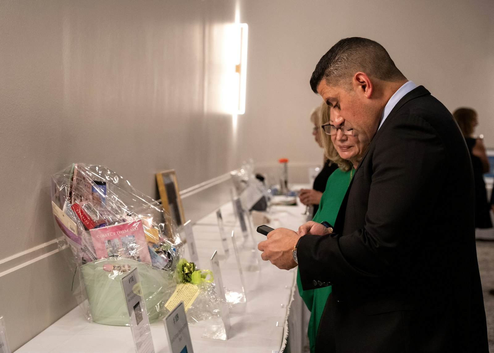 Patrons check out some of the items for bid during the silent auction, with all proceeds supporting the Residences at St. Matthew.