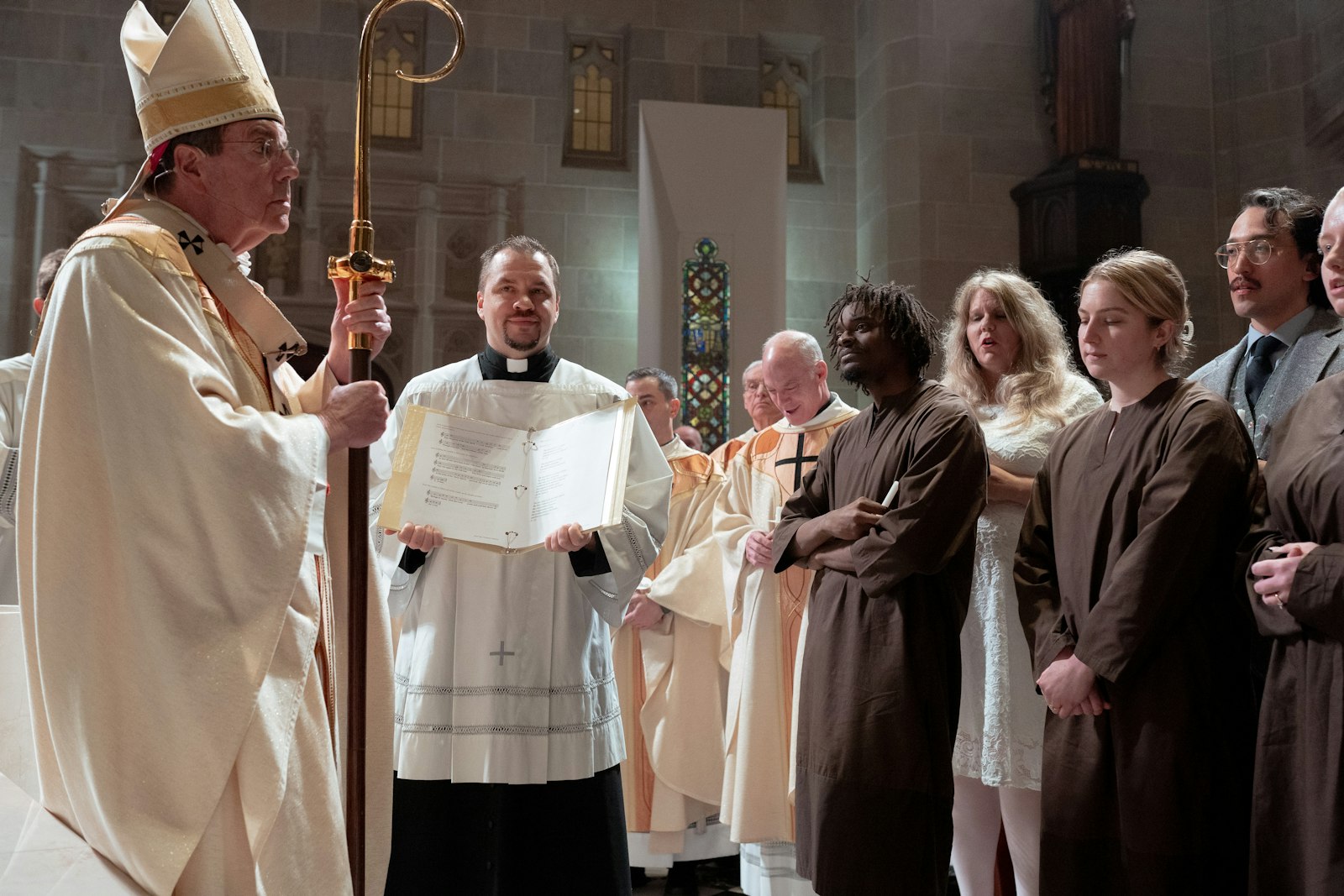 Archbishop Vigneron questions six catechumens preparing to be baptized during the Easter vigil about their intention to join the Catholic Church.