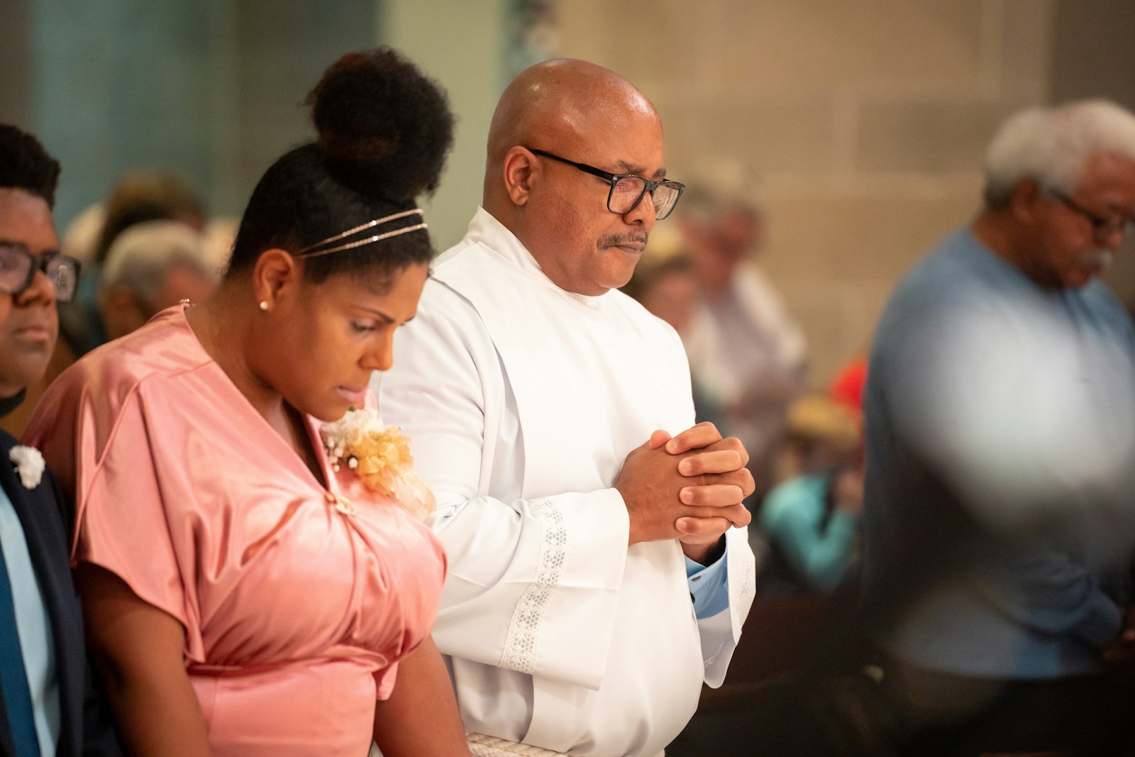 Deacon Sidney Johnson prays next to his wife, Erinn, during the Rite of Ordination of Deacons for the Archdiocese of Detroit on Oct. 1. Erinn Johnson told Detroit Catholic about the formation deacon's wives go through alongside their husbands. Deacon Johnson's first assignment will be at Christ the Redeemer Parish in Lake Orion.