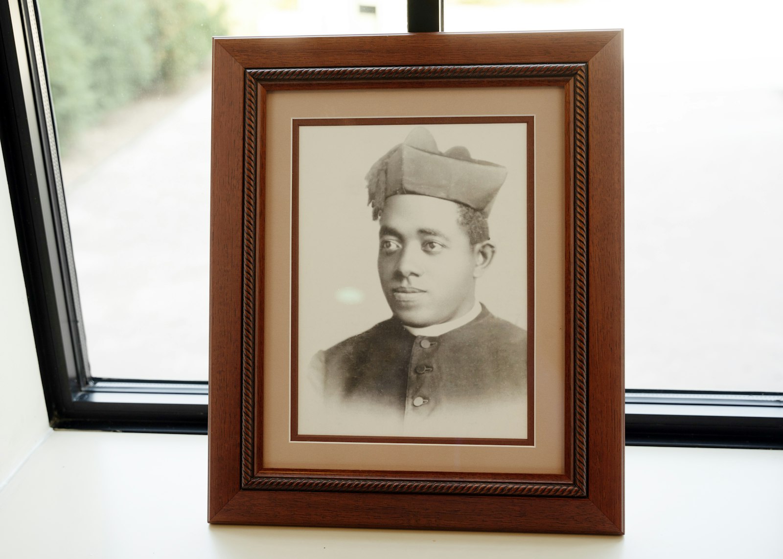 A photograph of Venerable Fr. Augustus Tolton, the first Black priest in the United States, is seen at the Solanus Casey Center. Bishop Perry is the postulator for his sainthood cause.