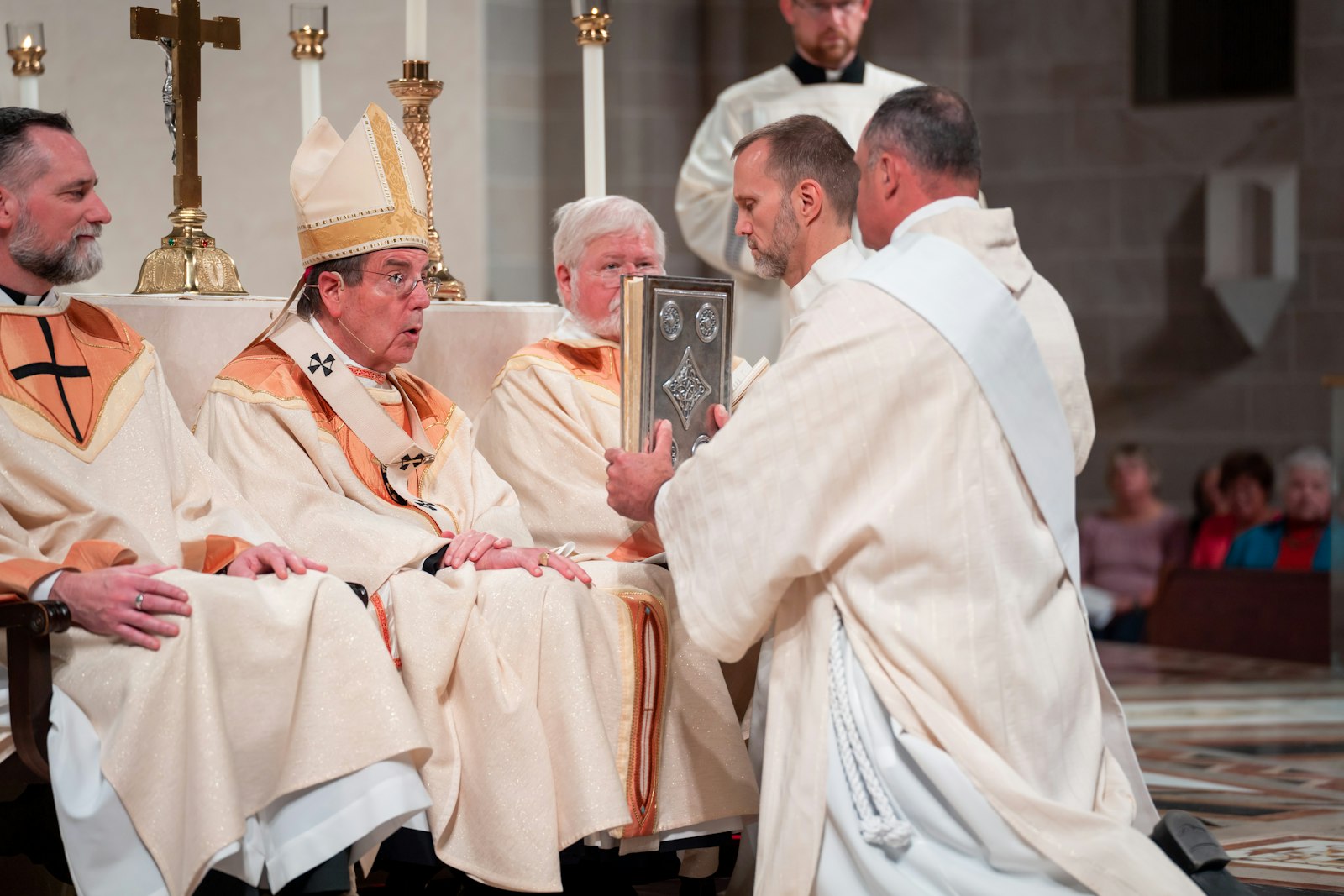 Deacon Alan Pionk receives the book of the Gospels from Archbishop Allen H. Vigneron of Detroit during the Ordination of Deacons for the Archdiocese of Detroit on Oct. 1. Deacon Pionk's first assignment will be at St. Christopher Parish in Marysville.