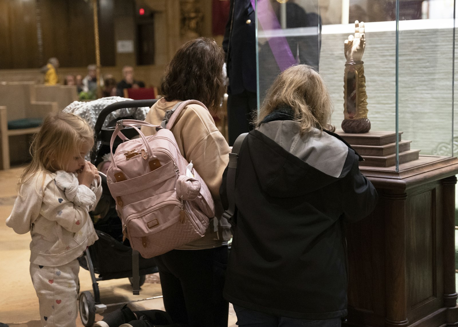 Families came together to venerate the relic, kneeling for a few moments after waiting in line sometimes for more than an hour. The faithful will have three more chances to venerate the relic -- today at the Cathedral of the Most Blessed Sacrament in Detroit, Tuesday at Divine Child Parish in Dearborn, and Wednesday at Mother of God Chaldean Catholic Church in Southfield -- before it moves to the Archdiocese of Cincinnati.