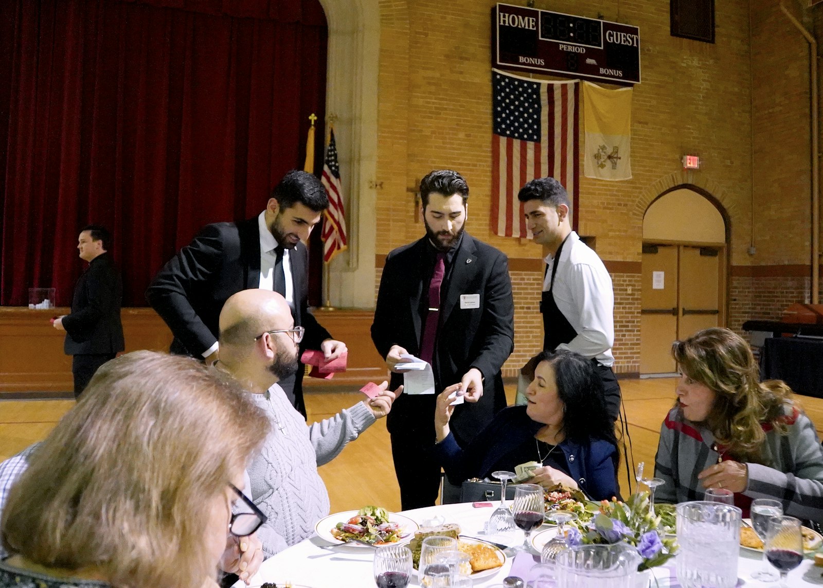 Seminarians sell raffle tickets to the dinner's attendees, with the proceeds all going to the Lennon Center. Bolton said the pro-life mission of Lennon Center supports both mother and baby and is lived out through services including pregnancy testing, ultrasounds, counseling and parenting classes.