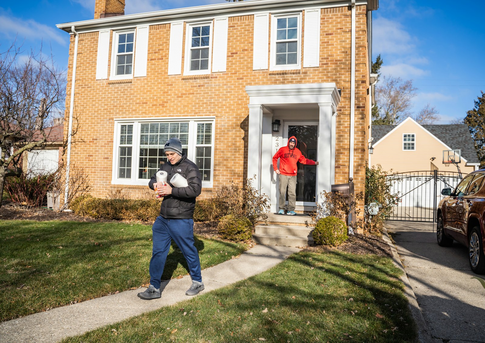 The teens from Shrine were split into teams and given grocery carts to participate in a scavenger hunt. They were tasked with finding a list of items worth different points and went door to door in the surrounding neighborhood to collect food items and coats that the teens would later donate to a pantry in Detroit.