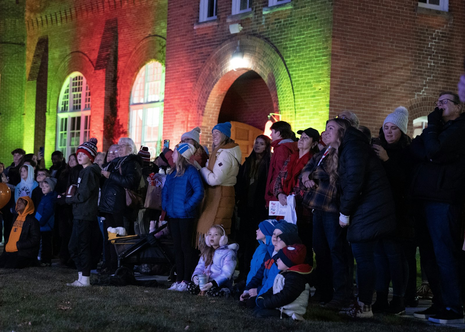 Families "ooh" and "ahh" as the Christmas tree is lit at the center of campus Nov. 19. (Gabriella Patti | Detroit Catholic)