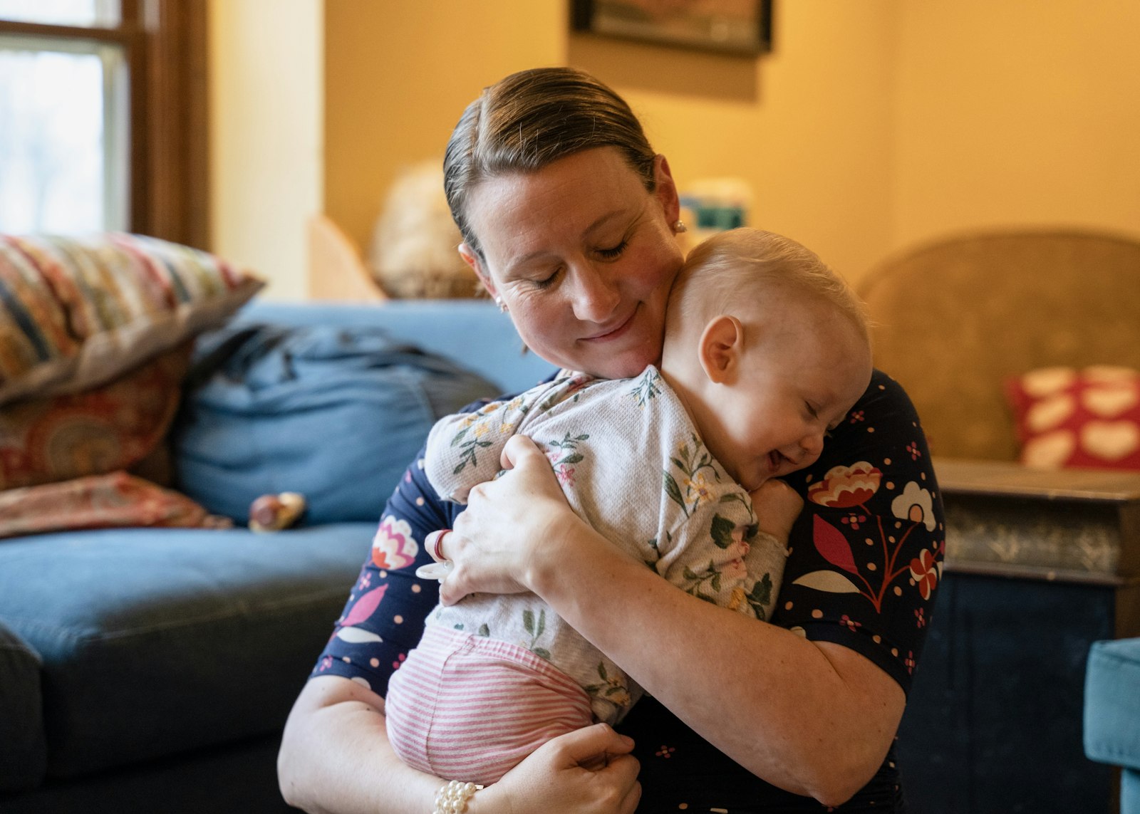 Pressprich, holding her youngest child, hopes her book gives parents the confidence to be the first educators of their own children.